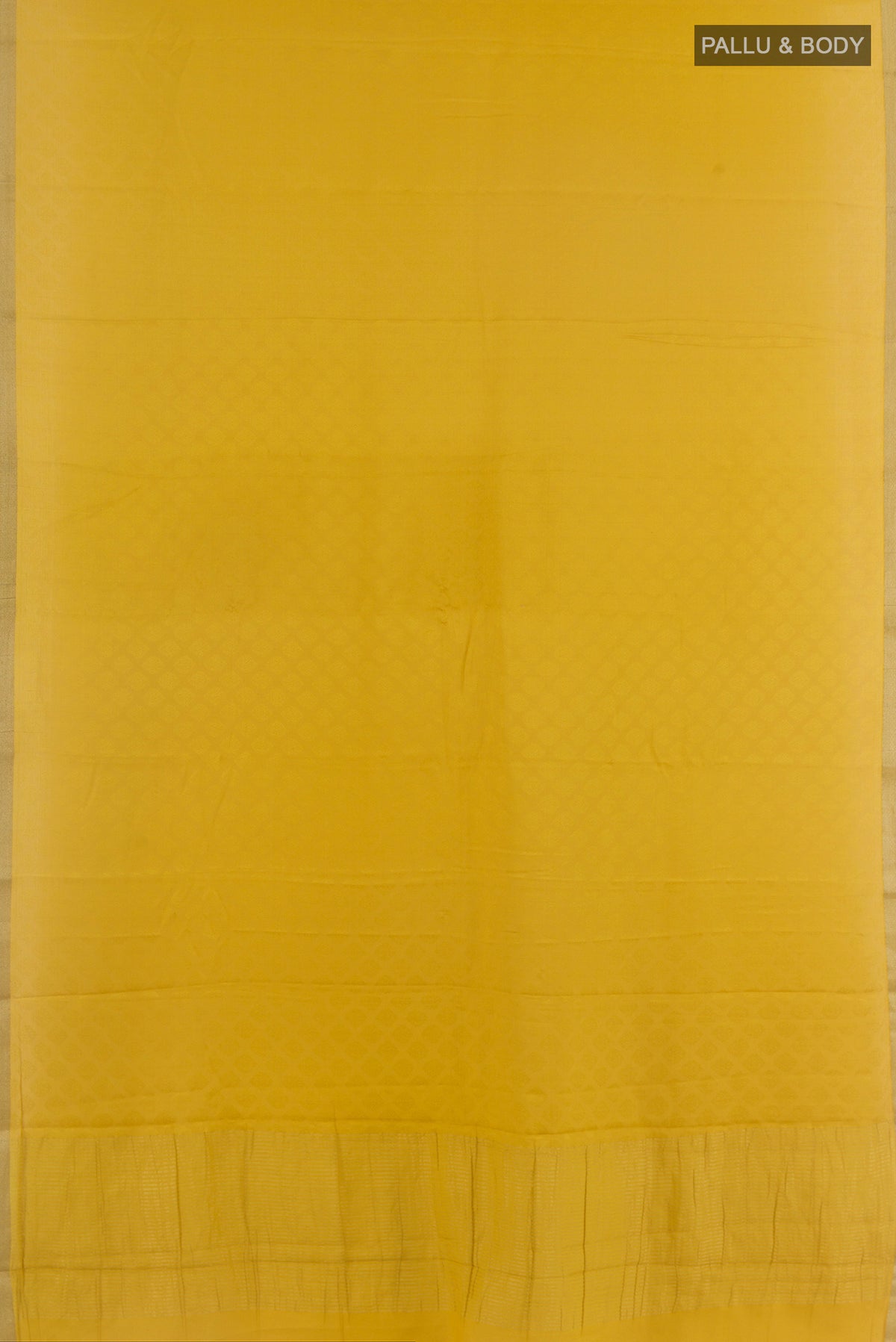 Flat view of Yellow Mysore Crepe Saree with Jacquard design on the body and Zari Border. 