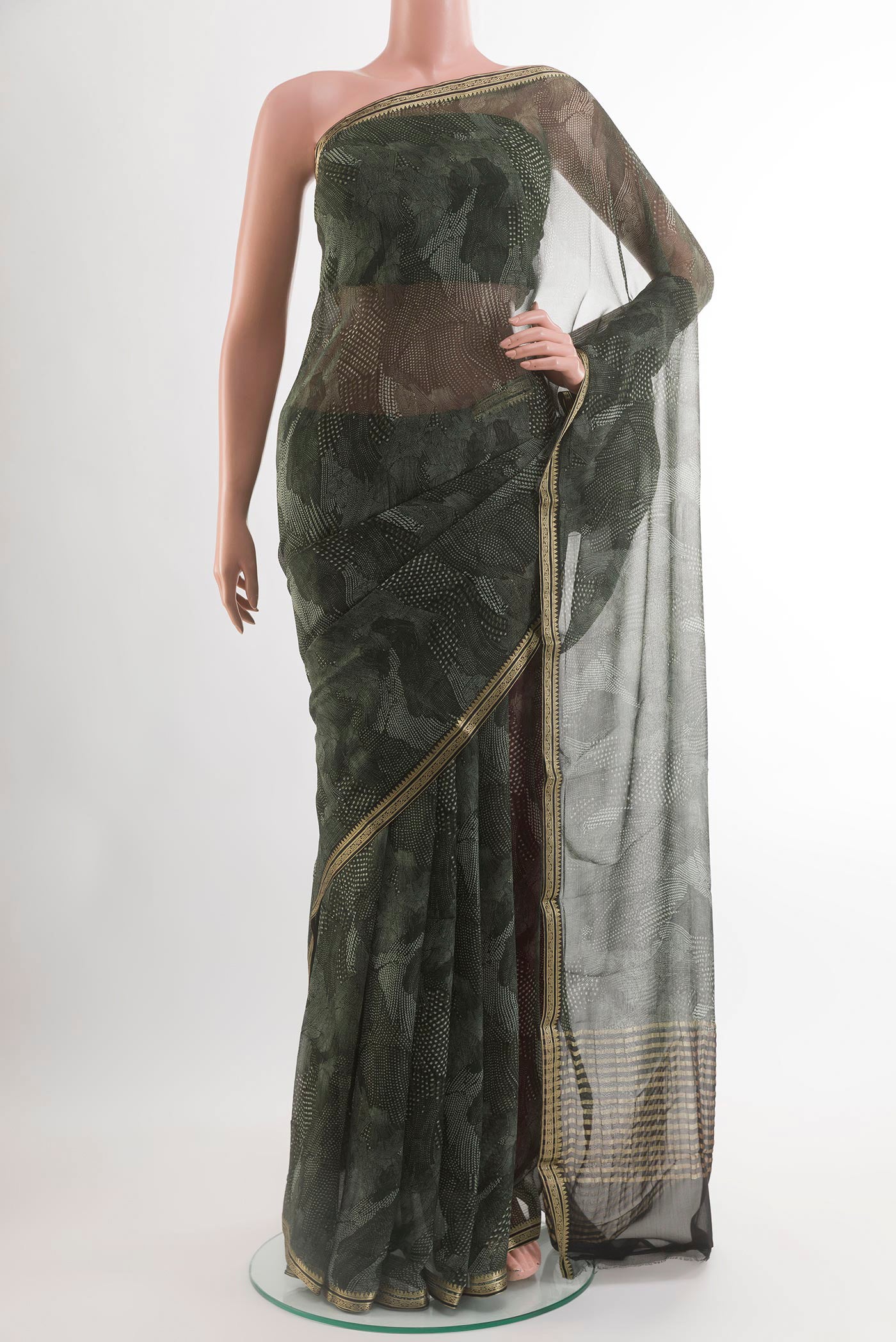 Grey Chiffon Saree with Printed design on the body and Zari Border.  displayed on a mannequin