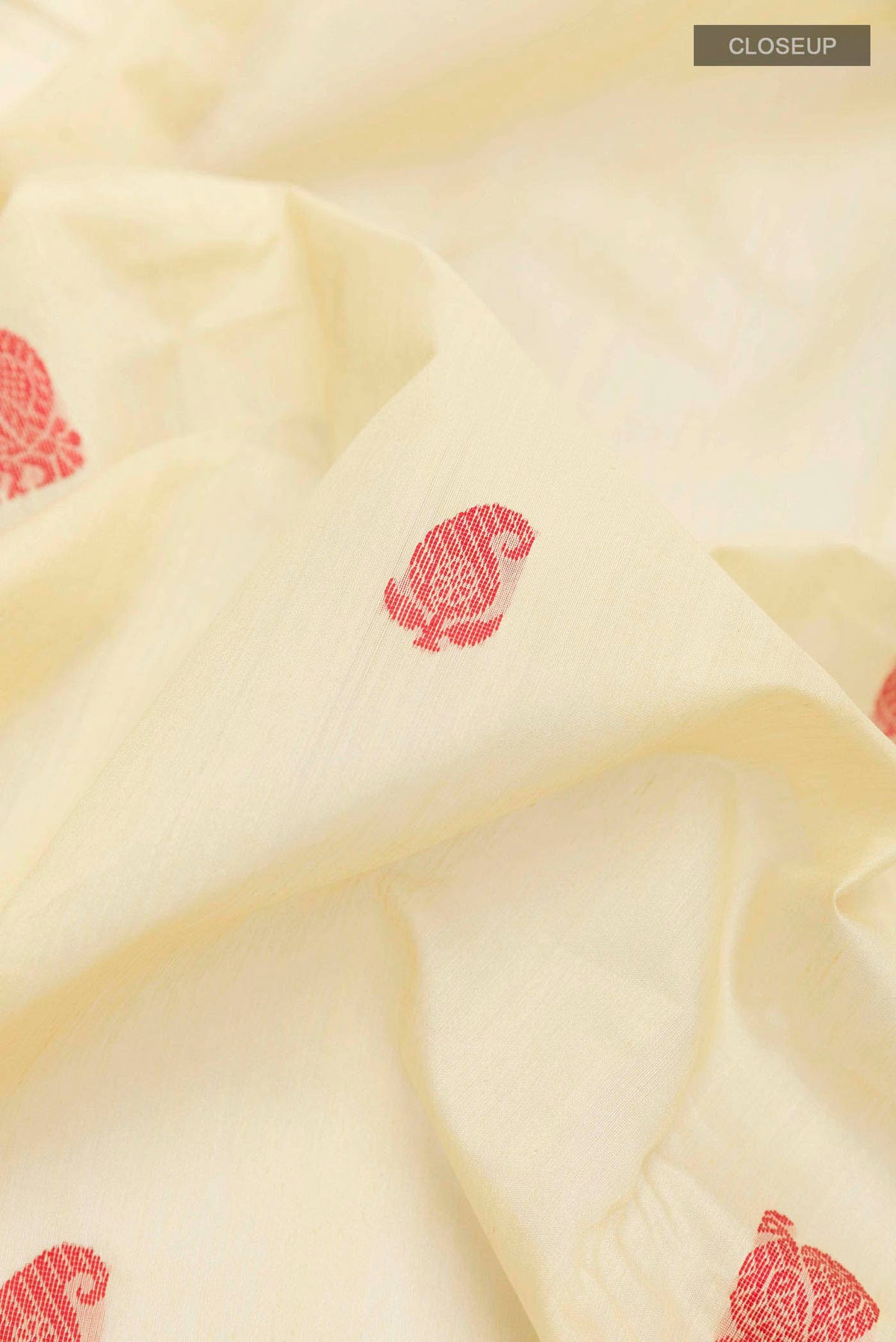 Close up of Lemon Yellow Chanderi Silk Cotton Saree with Thread Butta on the body and Zari Border displaying folds