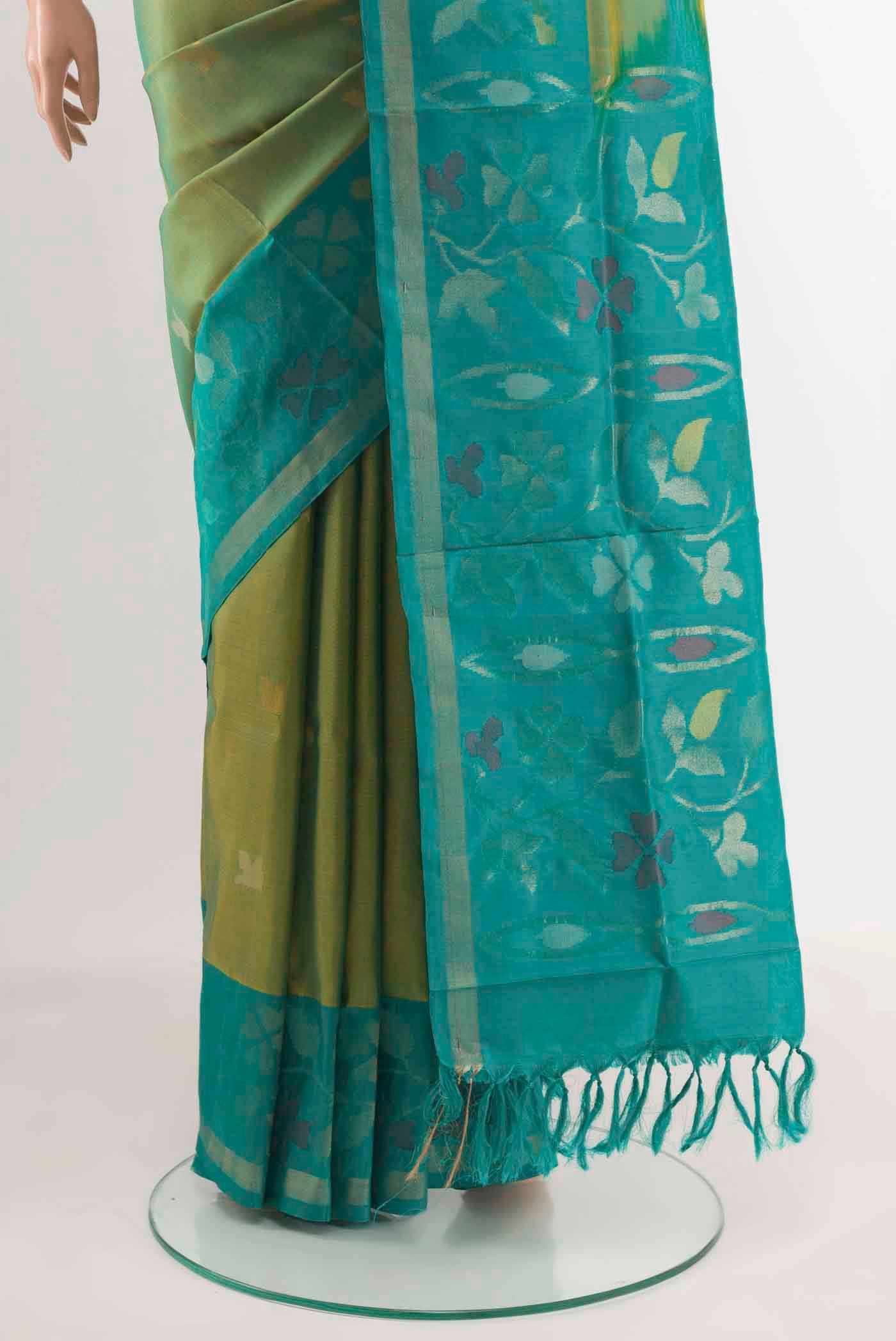 Pleats and pallu of Green Uppada Silk Saree with Zari Butta on the body and Zari Border