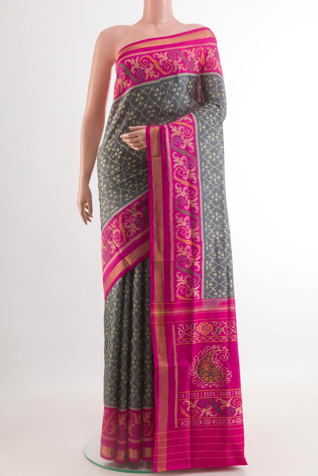 Grey Rajkot Patola Silk Saree with Pure Ikat on the body and Zari Border.  displayed on a mannequin