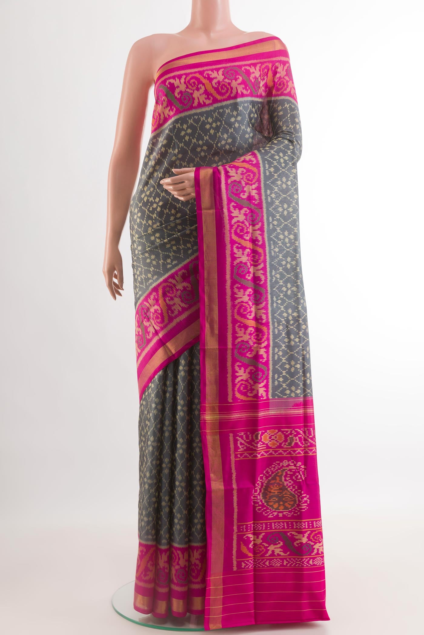 Grey Rajkot Patola Silk Saree with Pure Ikat on the body and Zari Border.  displayed on a mannequin