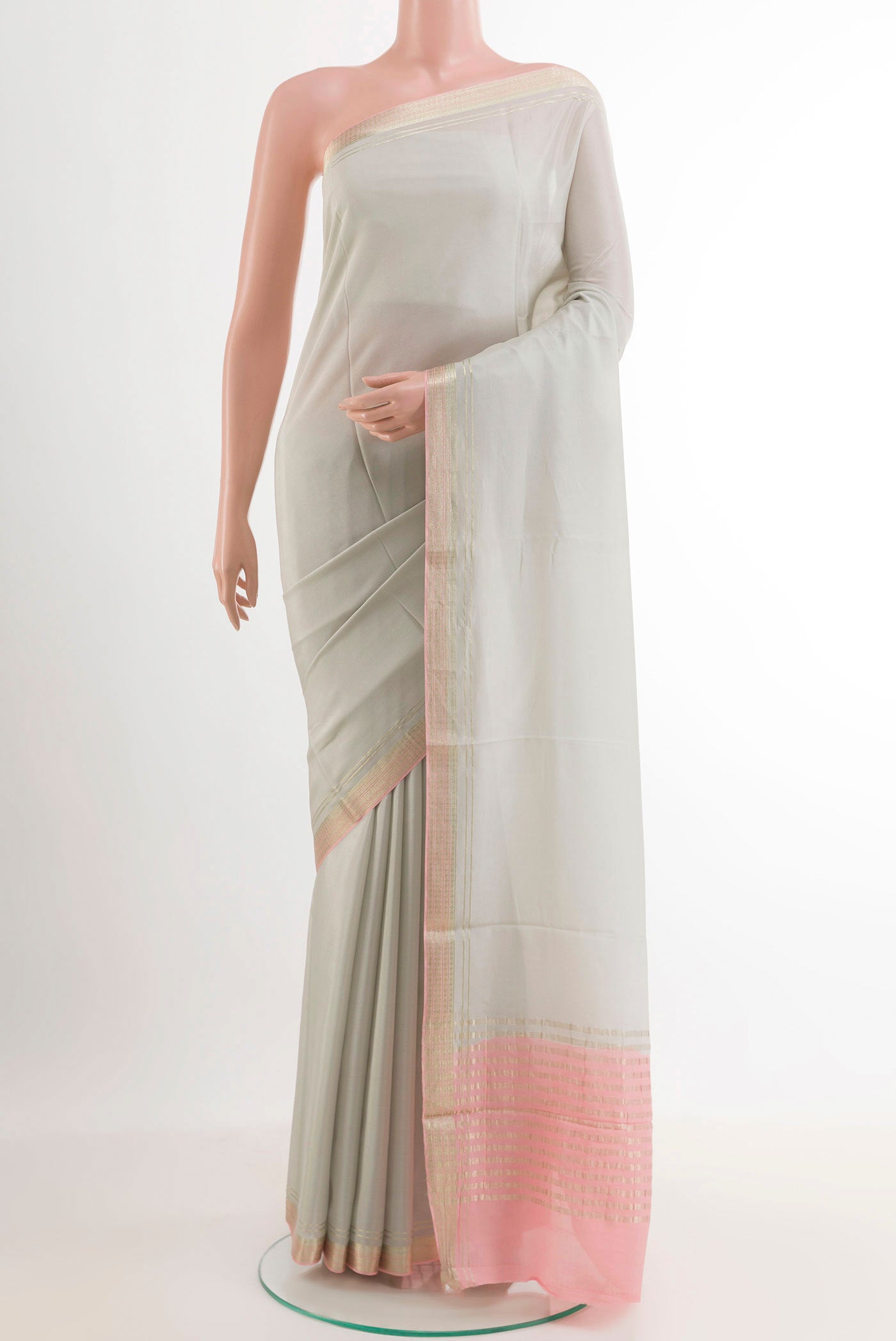 Off White Mysore Crepe Saree with Plain Body and Zari Border.  displayed on a mannequin
