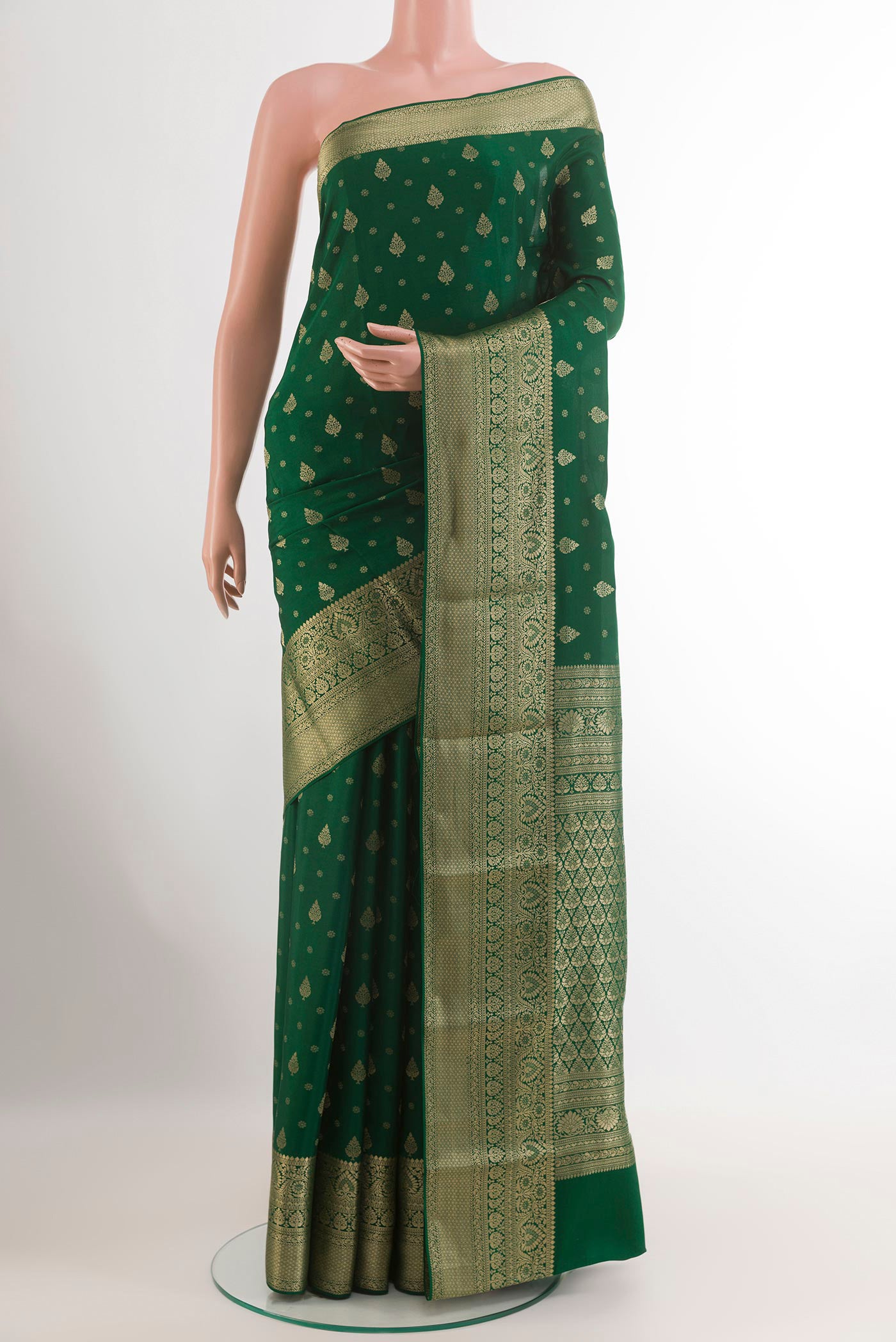 Green Mysore Crepe Saree with Zari Butta on the body and Zari Border.  displayed on a mannequin