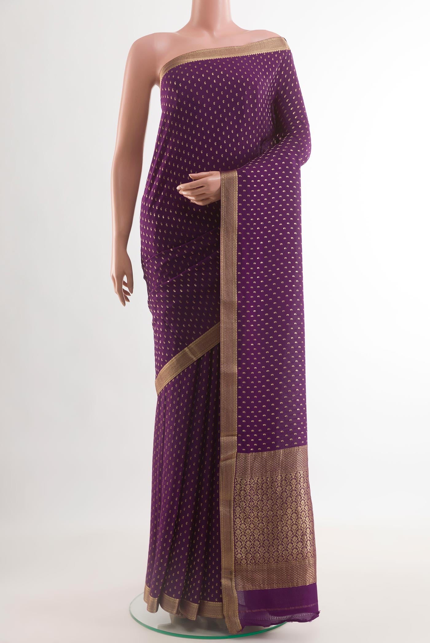 Violet Mysore Crepe Saree with Zari Butta on the body and Zari Border.  displayed on a mannequin