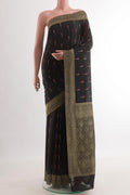 Black Mysore Crepe Saree with Zari Butta on the body and Zari Border.  displayed on a mannequin