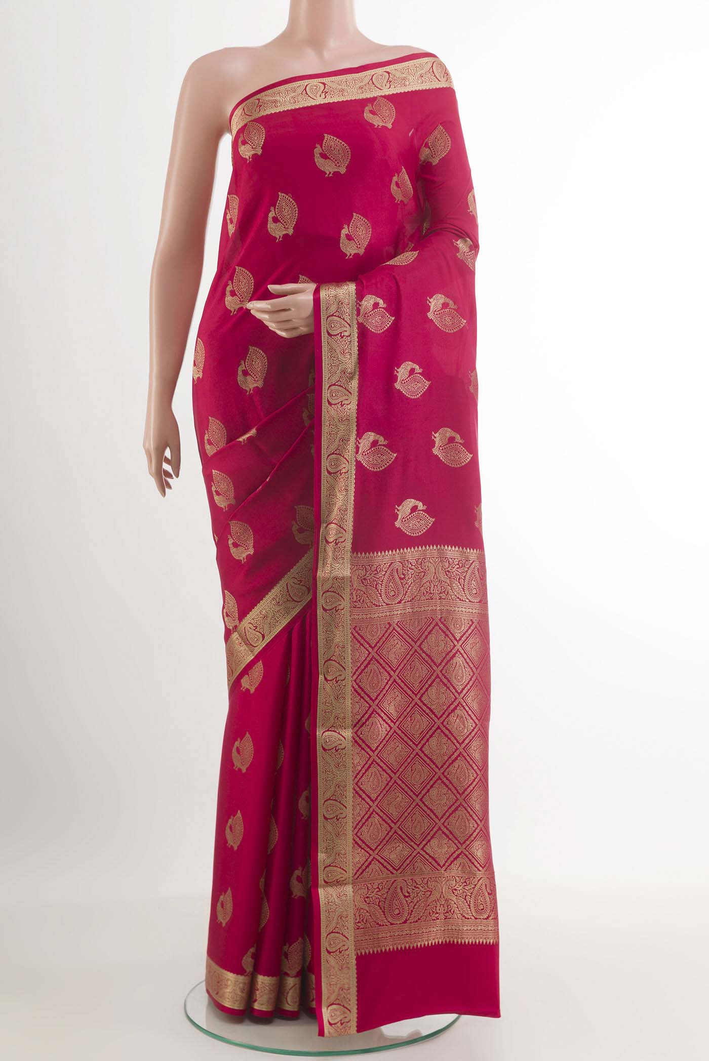 Red Mysore Crepe Saree with Zari Butta on the body and Zari Border.  displayed on a mannequin