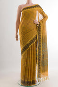 Yellow Coimbatore Cotton Saree with Checked design on the body and Thread Border.  displayed on a mannequin