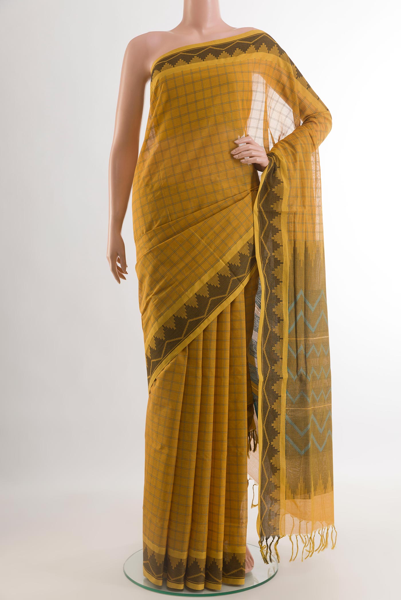 Yellow Coimbatore Cotton Saree with Checked design on the body and Thread Border.  displayed on a mannequin