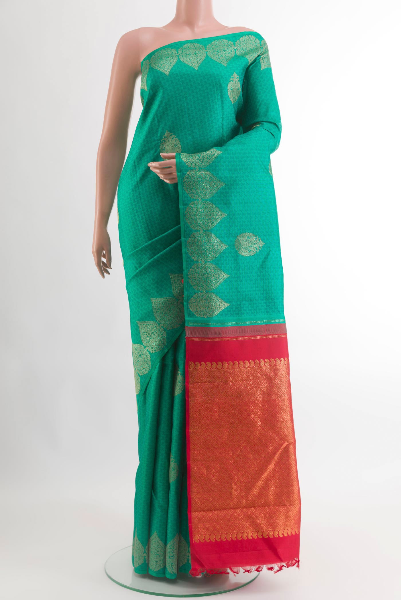 Sea Green Kanjivaram Silk Saree with Jacquard With Zari Butta on the body and Zari Border.  displayed on a mannequin