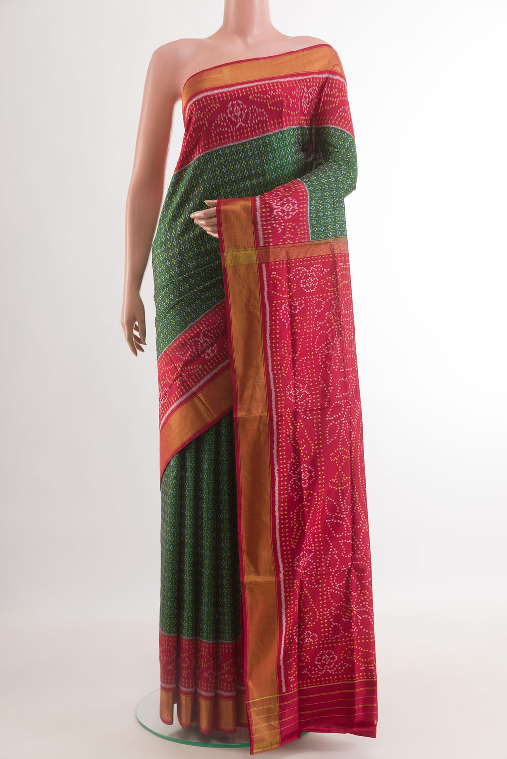 Green Rajkot Patola Silk Saree with Pure Ikat on the body and Ikat Border.  displayed on a mannequin