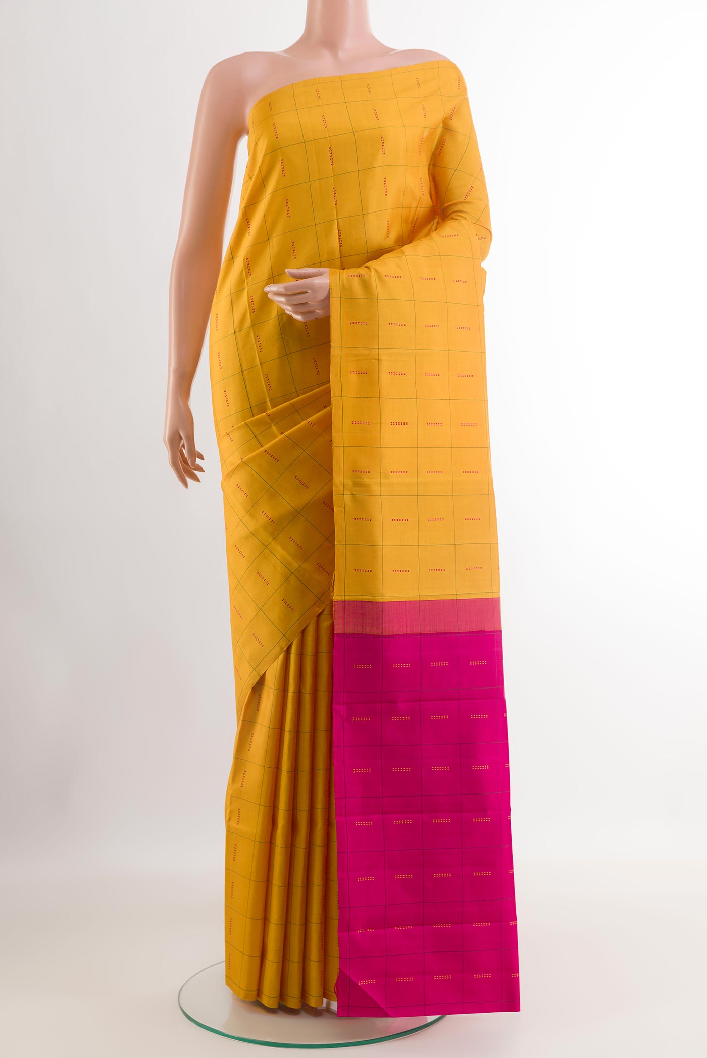 Yellow Kanjivaram Silk Saree with Checked design on the body and Without Border.  displayed on a mannequin
