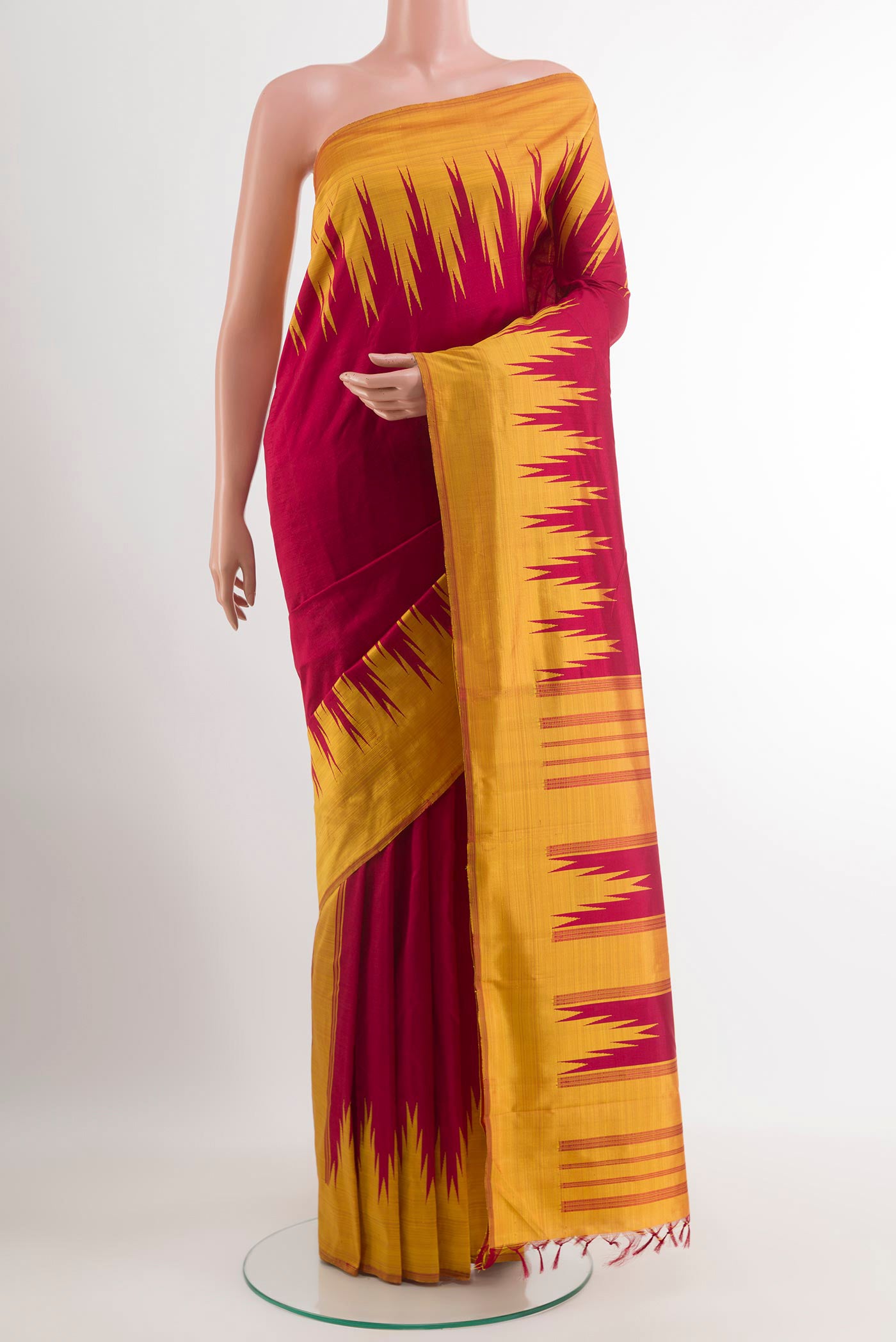 Red Kanchipuram Silk Saree with Plain Body and Temple Border.  displayed on a mannequin