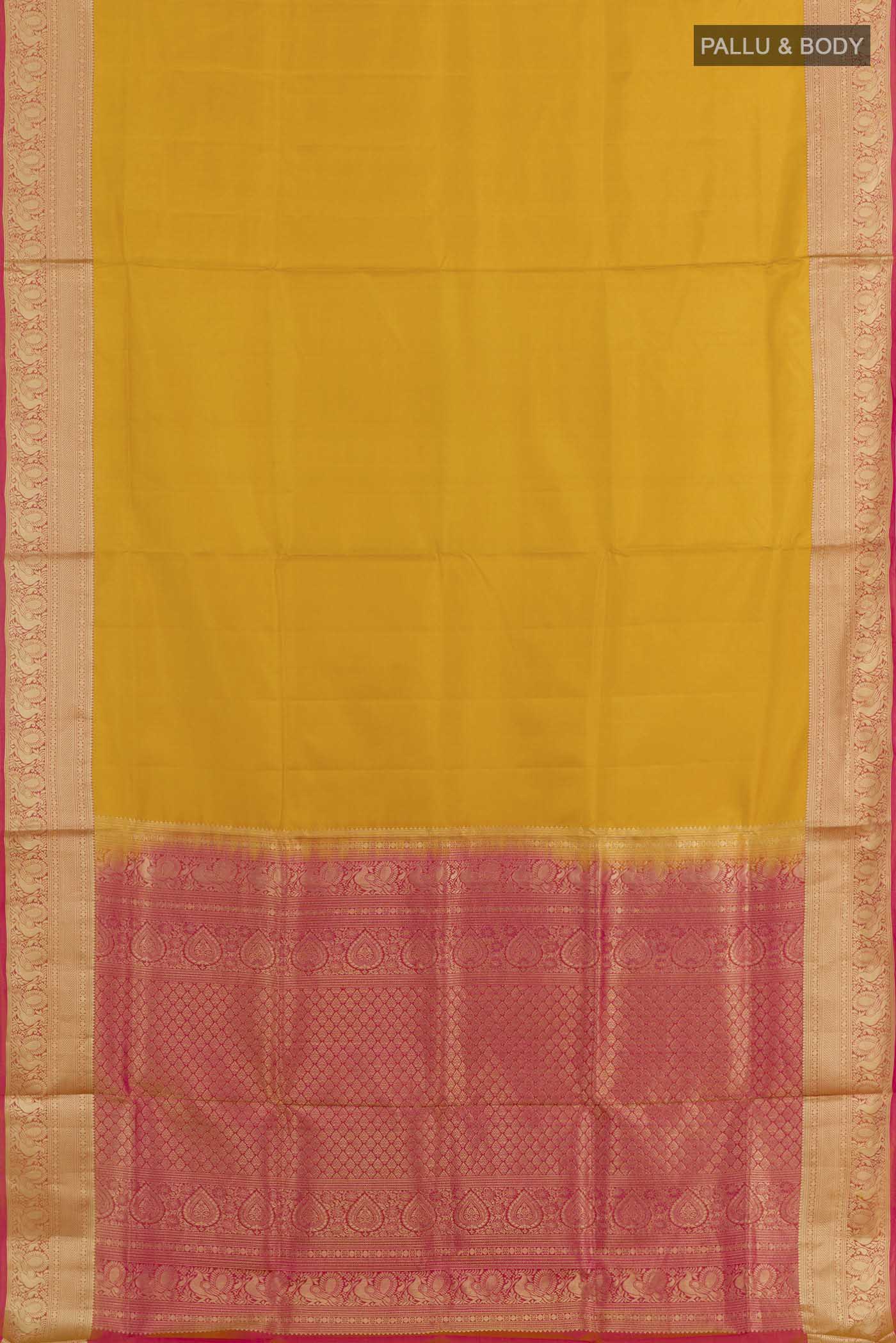 Flat view of Yellow Soft Silk Saree with Plain Body and Zari Border. 
