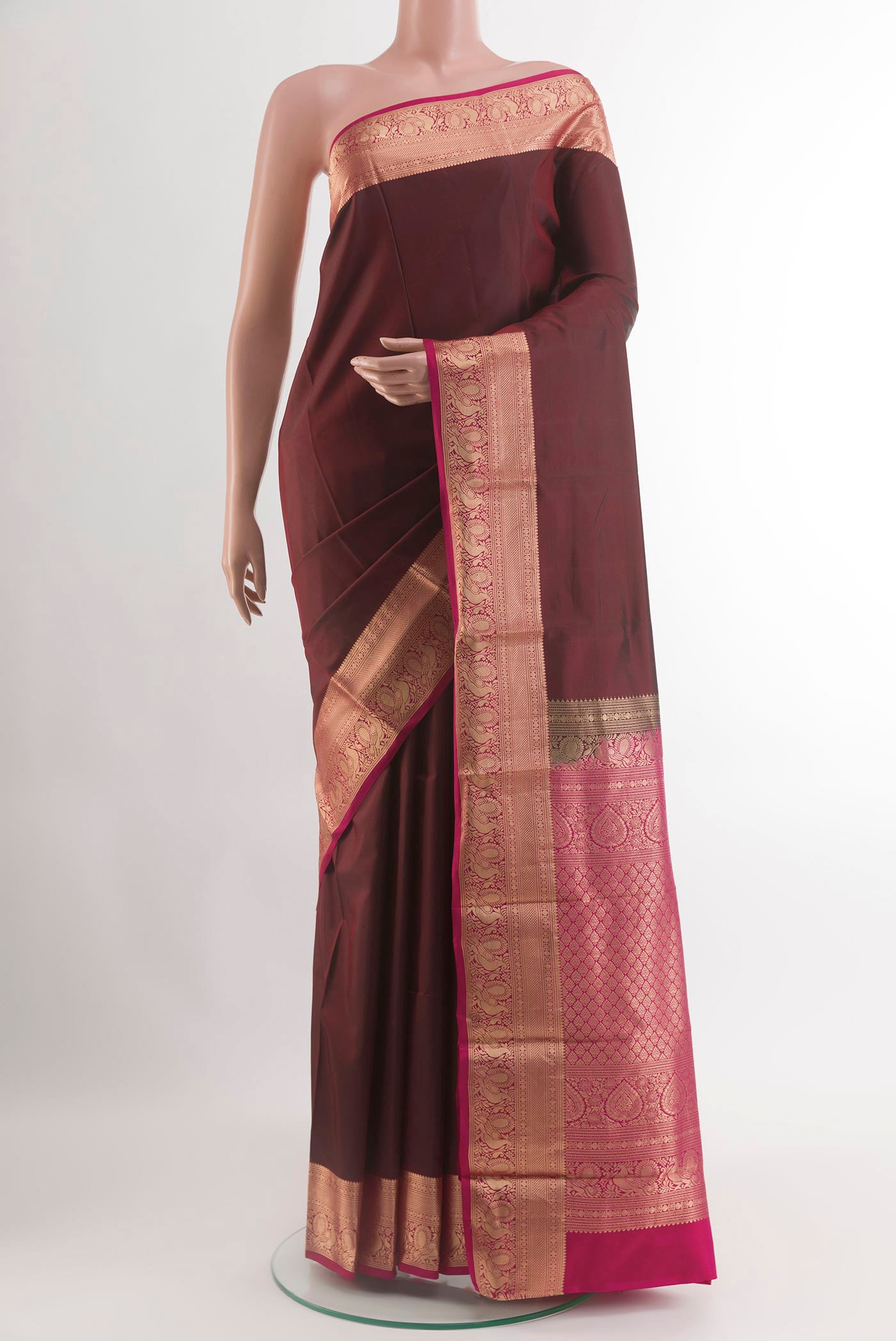 Brown Kanchipuram Silk Saree with Plain Body and Zari Border.  displayed on a mannequin