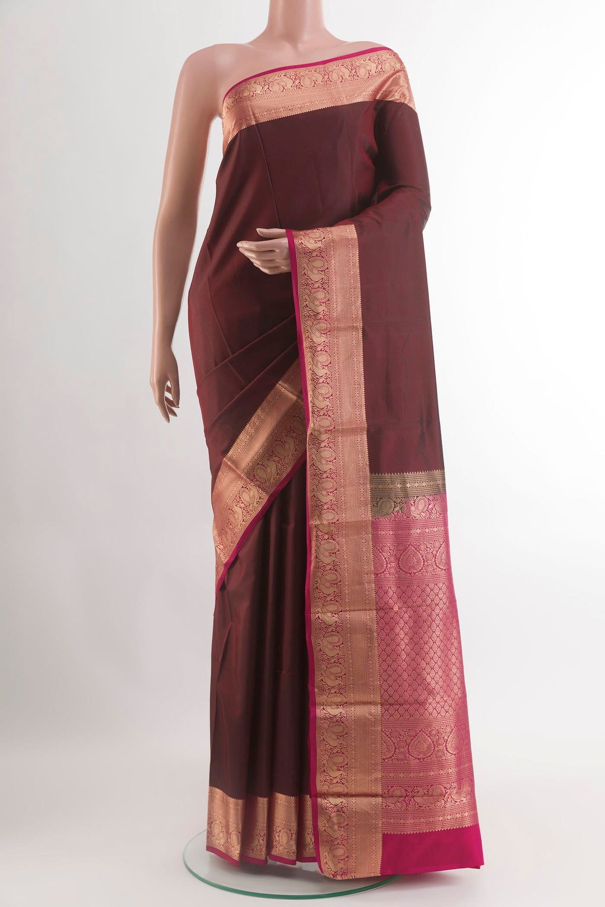 Brown Kanchipuram Silk Saree with Plain Body and Zari Border.  displayed on a mannequin