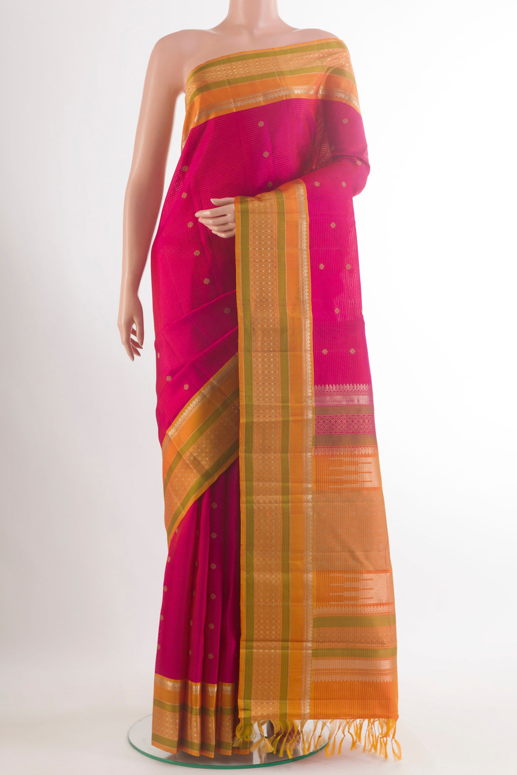 Pure Silk Pink Kanchipuram Saree with Zari Butta on the body and Zari Border.  displayed on a mannequin