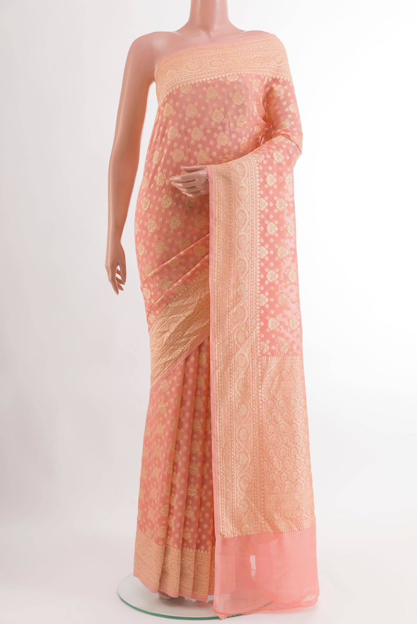 Peach Banarasi Georgette Saree with Zari Brocade on the body and Zari Border.  displayed on a mannequin