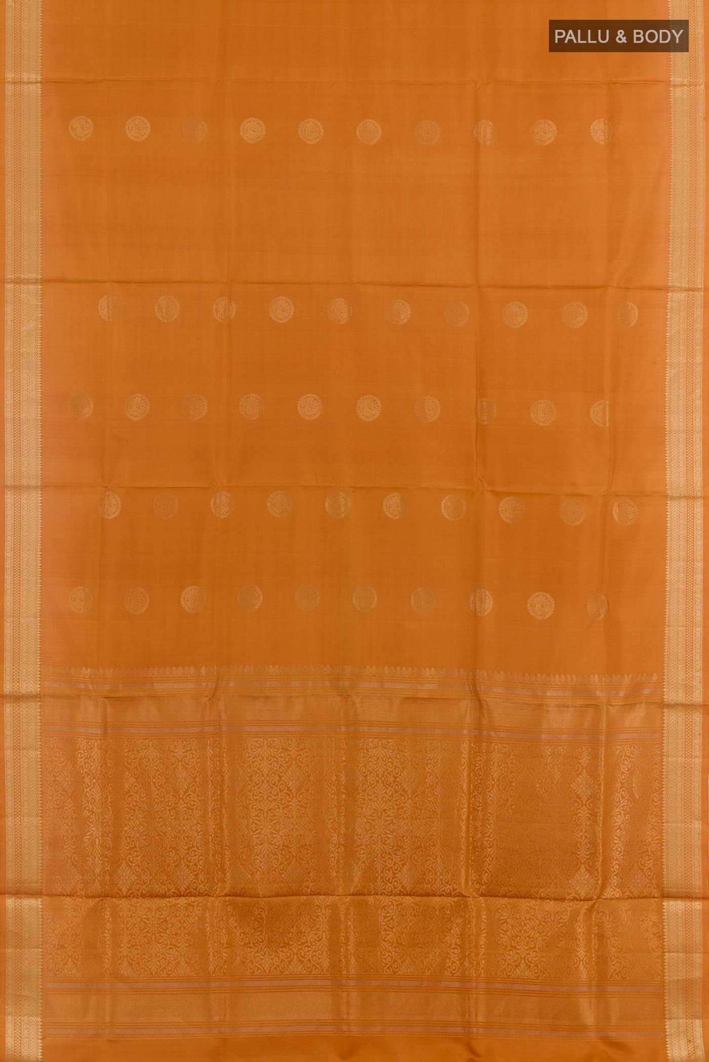 Flat view of Mustard Soft Silk Saree with Zari Butta on the body and Zari Border. 