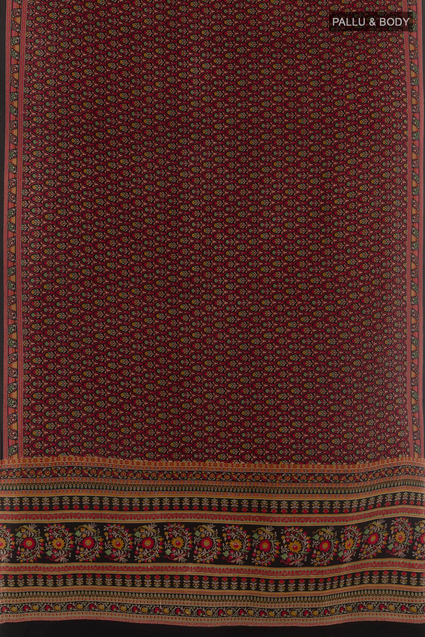Flat view of Red Crepe Saree with Printed design on the body and Printed Border. 