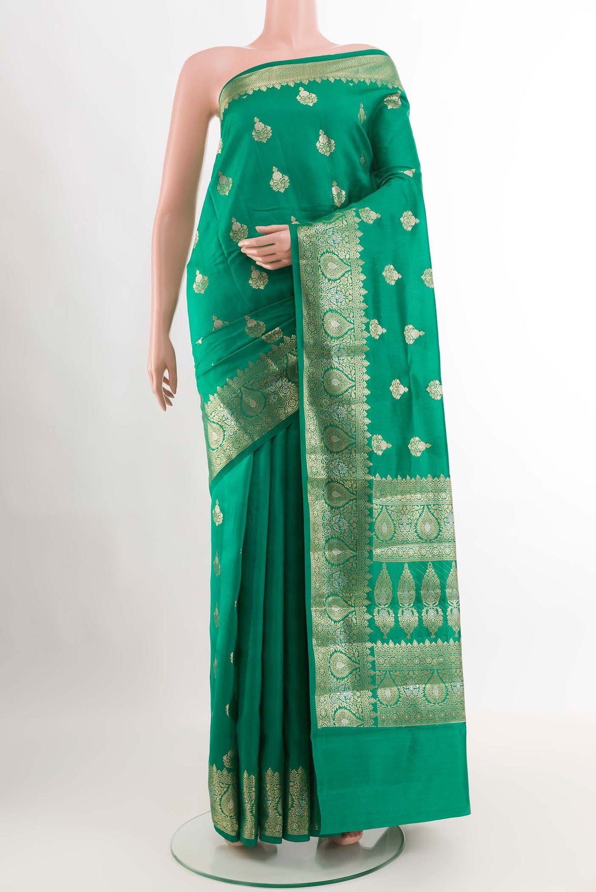 Green Tussar Silk Saree with Zari Butta on the body and Zari Border displayed on a mannequin