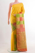 Yellow Kanchipuram Silk Saree with Plain Body and Rising Temple Border displayed on a mannequin