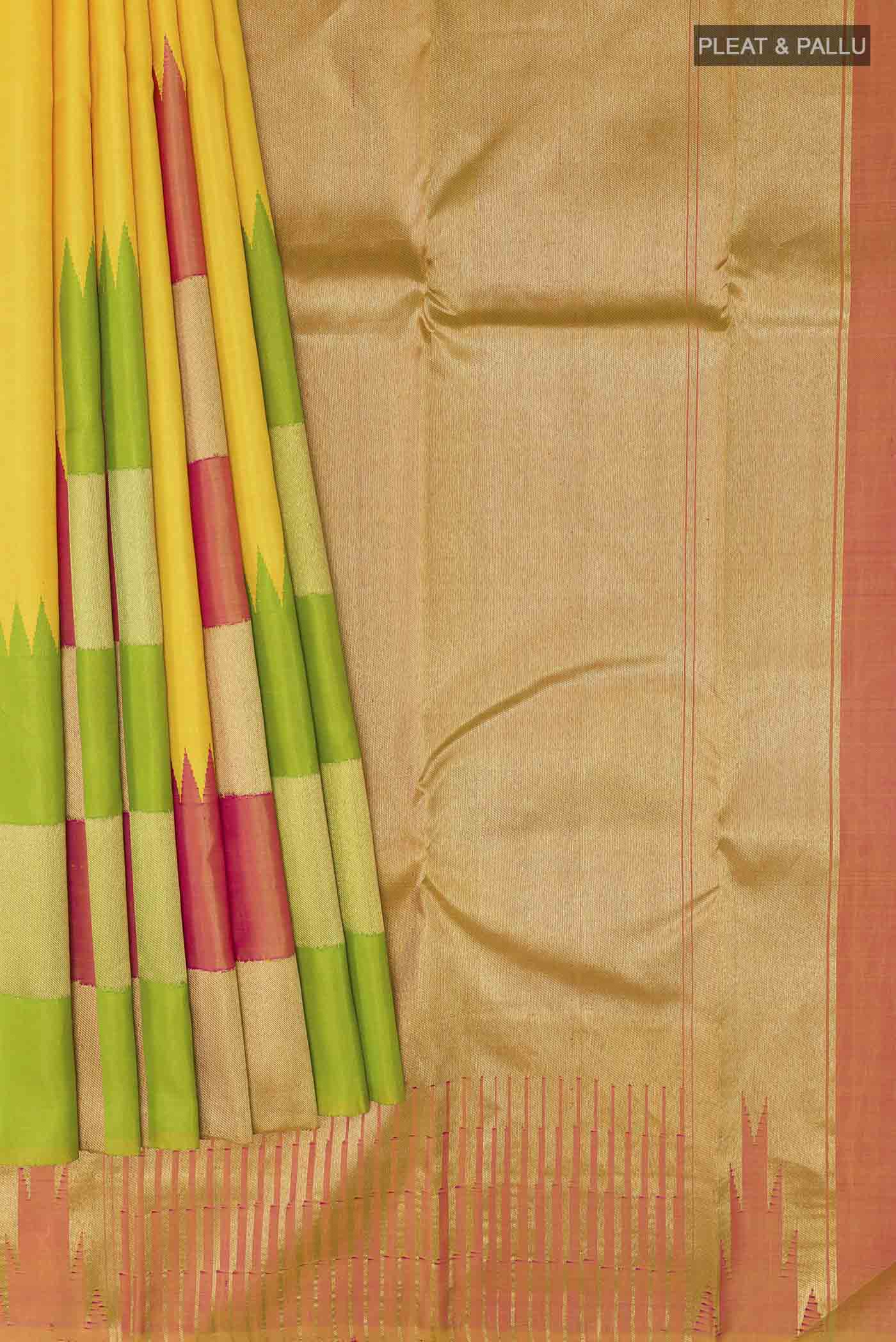Pleats and pallu of Yellow Kanchipuram Silk Saree with Plain Body and Rising Temple Border