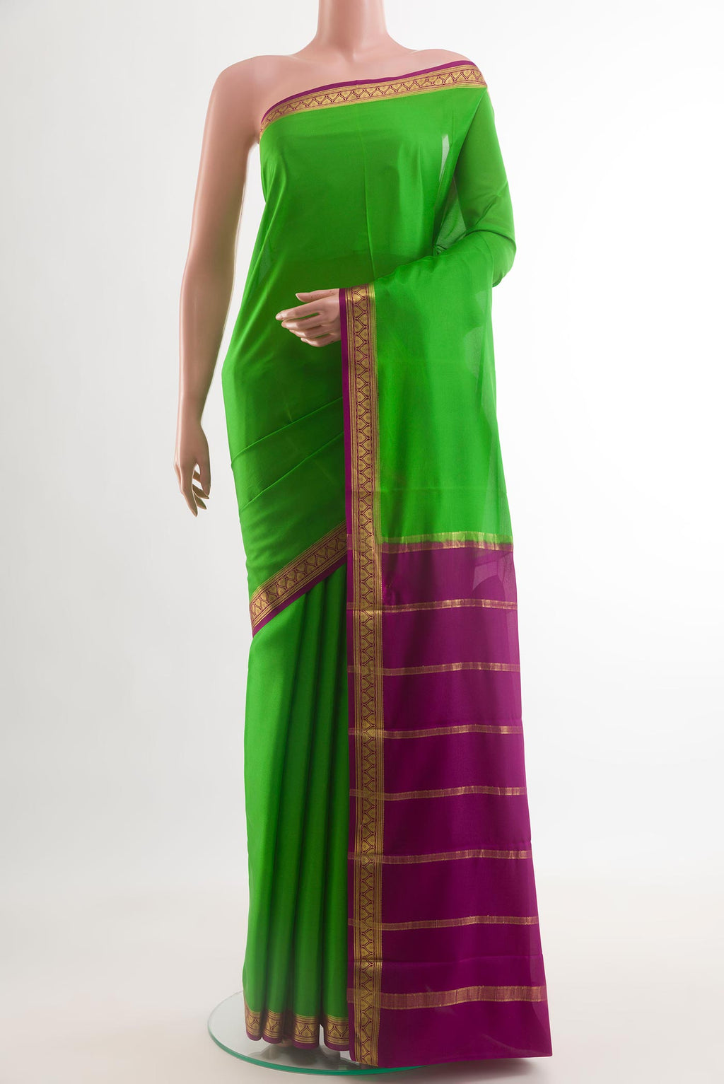 Green Mysore Crepe Saree with Plain Body and Zari Border.  displayed on a mannequin
