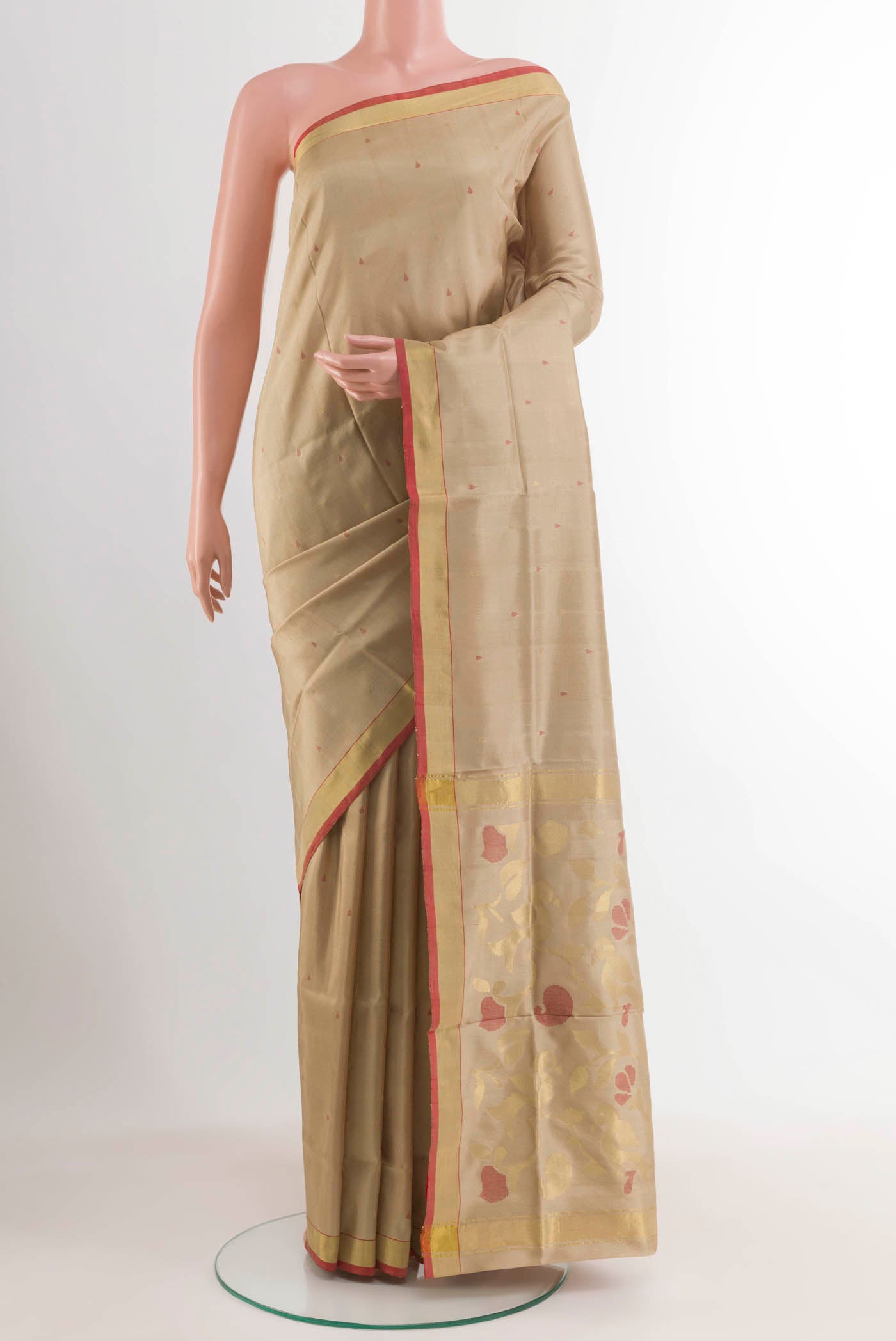 Beige Uppada Silk Saree with Zari Butta on the body and Zari Border displayed on a mannequin