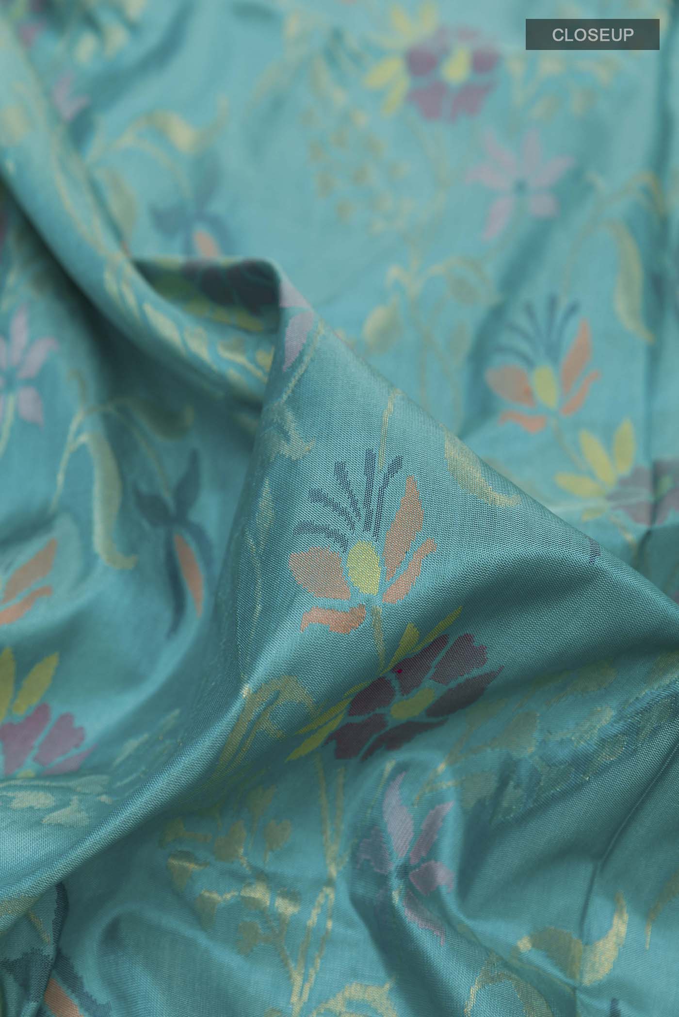 Close up of Pure Silk Pure Zari Blue Uppada Saree with Zari Brocade on the body and Zari Border displaying folds