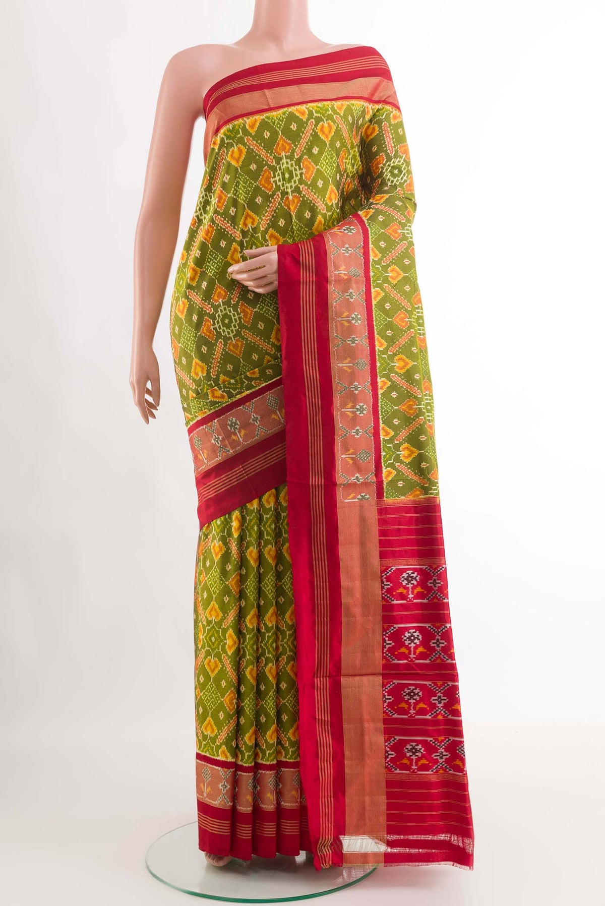 Green Dual Tone Pochampally Silk Saree With Ikat design on the body and Zari Border displayed on a mannequin