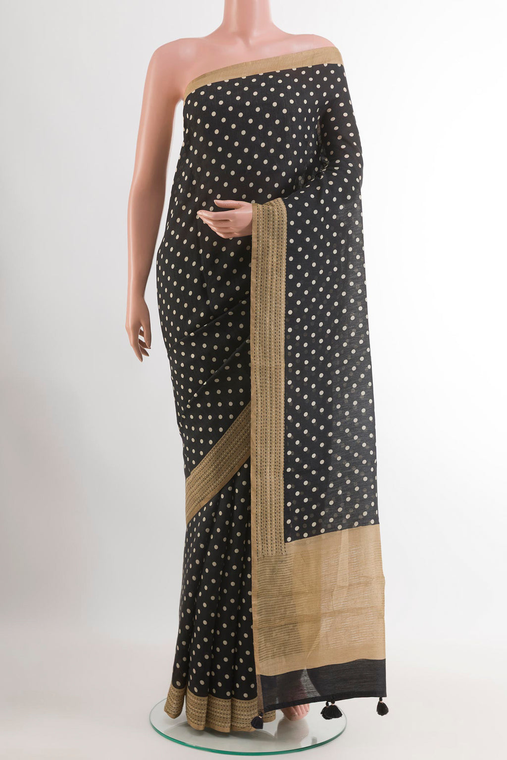 Black Tussar Saree with Polka Dots on the body and Thread Embroidery Border.  displayed on a mannequin