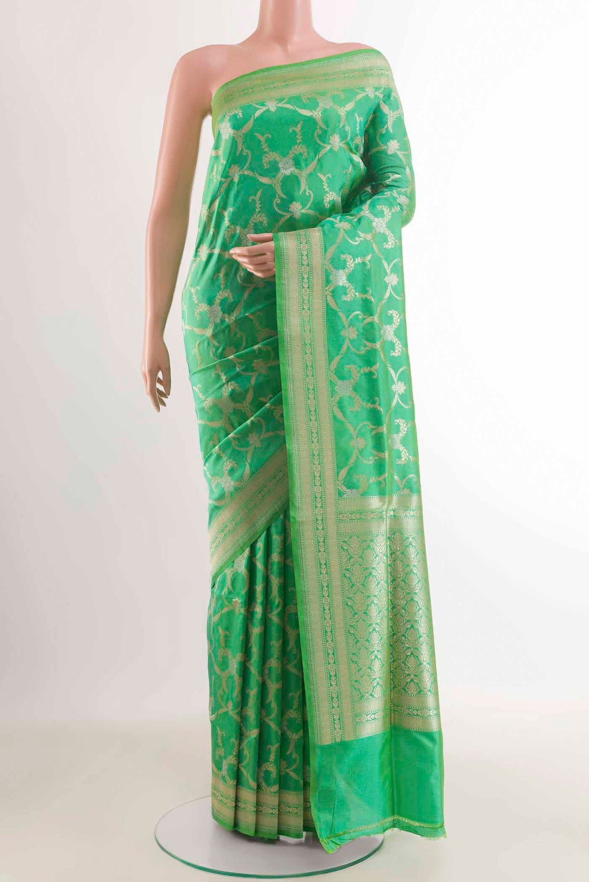 Green Banarasi Silk Saree with Zari Brocade on the body and Zari Border displayed on a mannequin