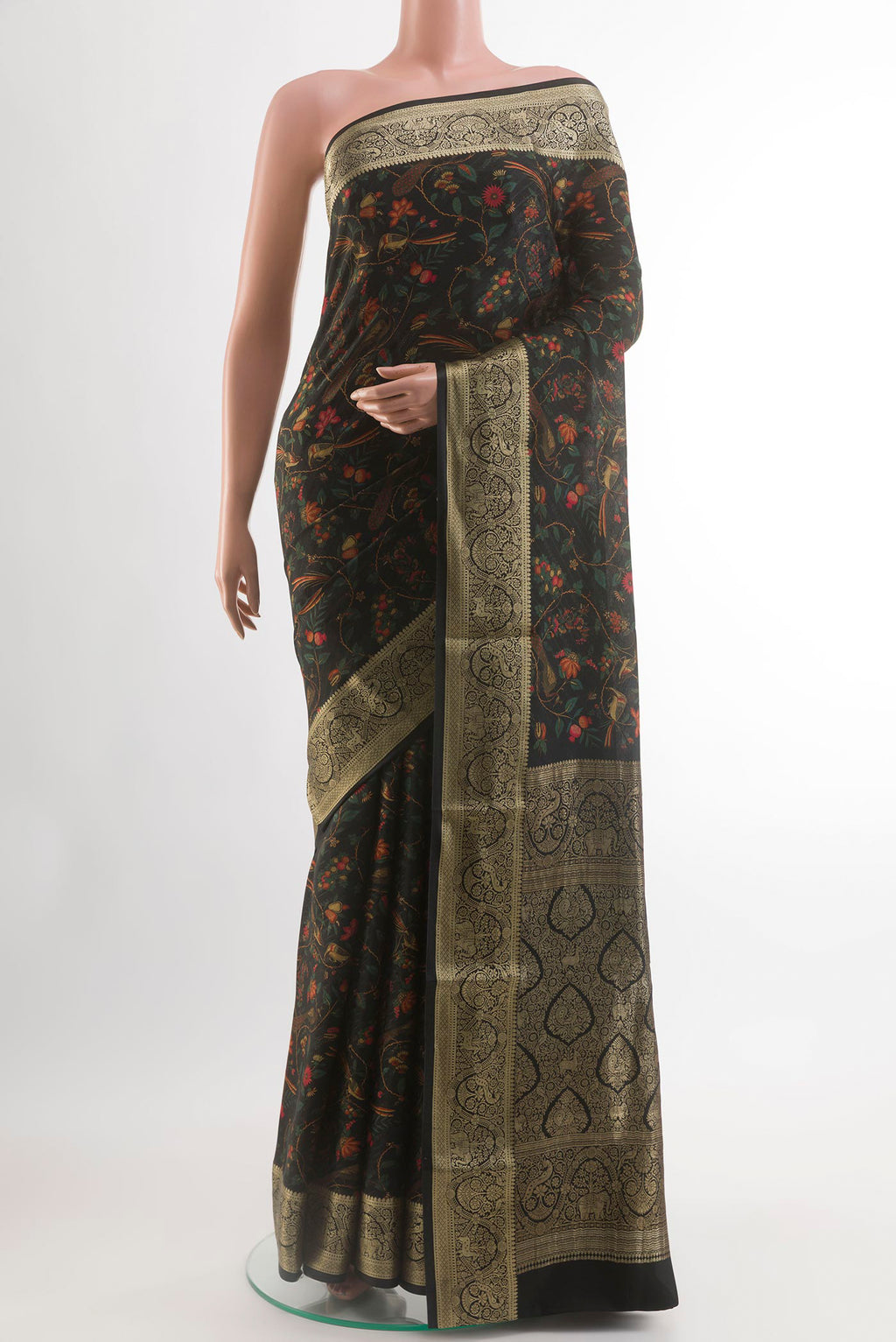 Black Crepe Saree with Printed design on the body and Zari Border.  displayed on a mannequin