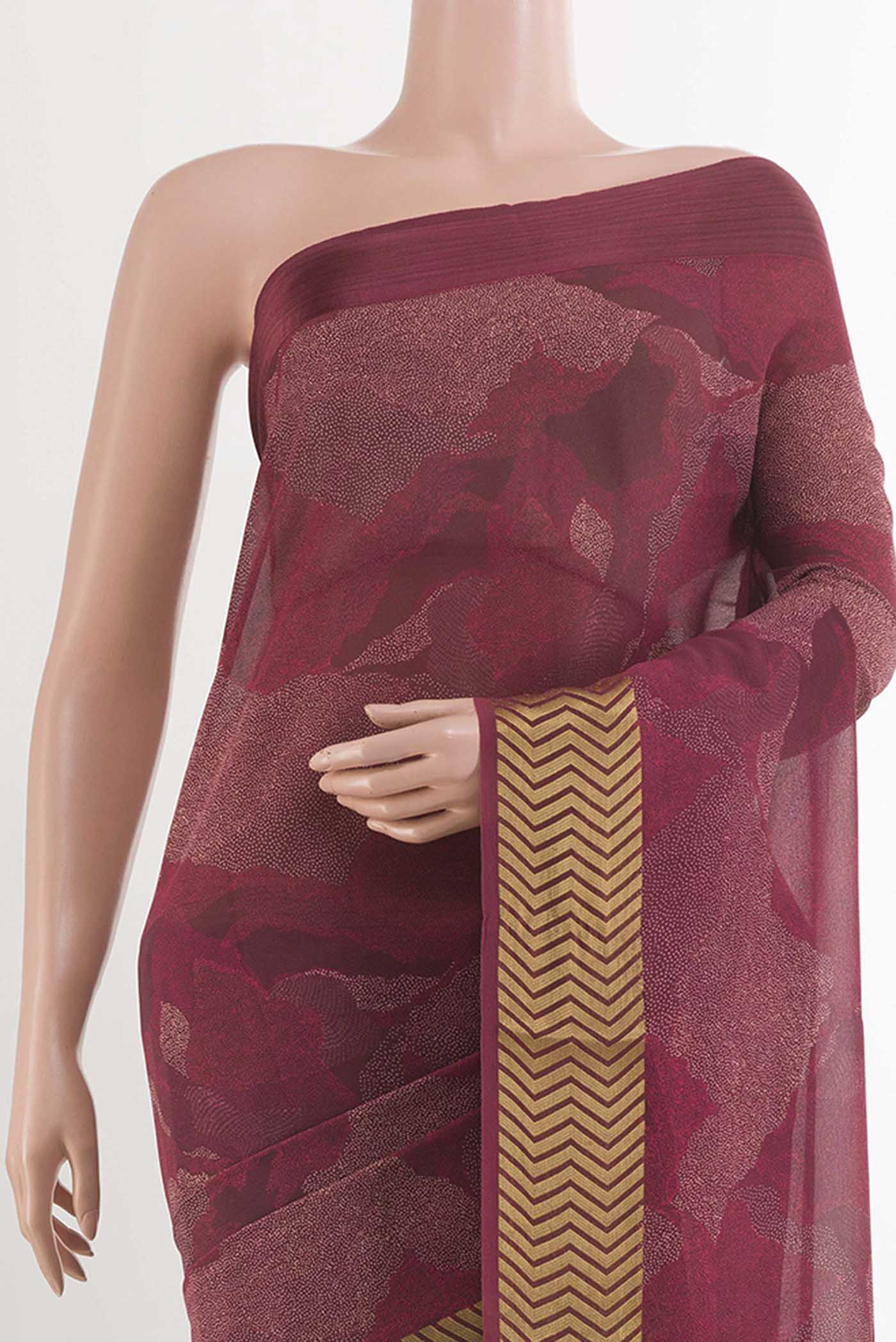 Border image of Maroon Crepe Saree With Printed design on the body and Zari Border