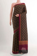 Black Printed Silk Saree With Printed design on the body and Printed Border displayed on a mannequin
