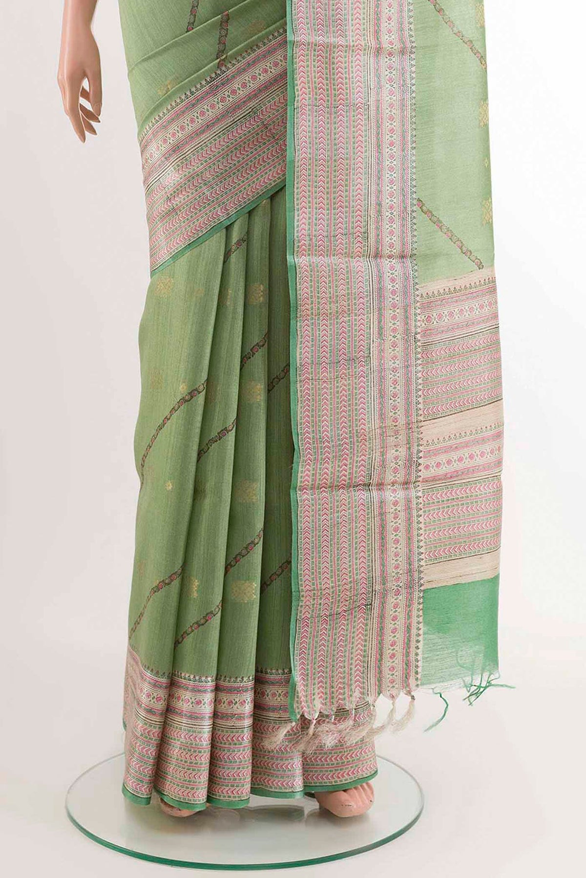 Pleats and pallu of Green Tussar Saree with Stripes on the body and Printed Border