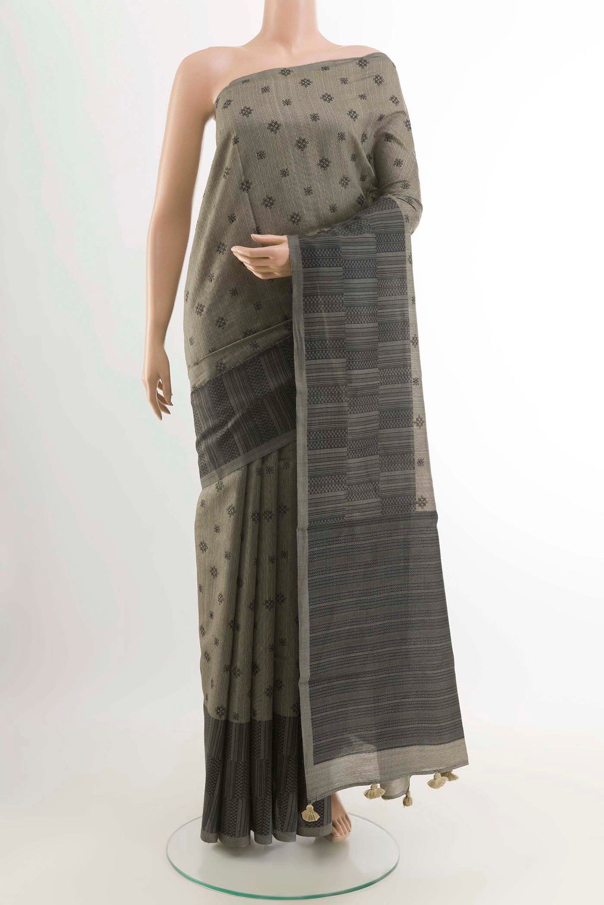 Davys Grey Tussar Saree with Embroidery on the body and Printed Border displayed on a mannequin