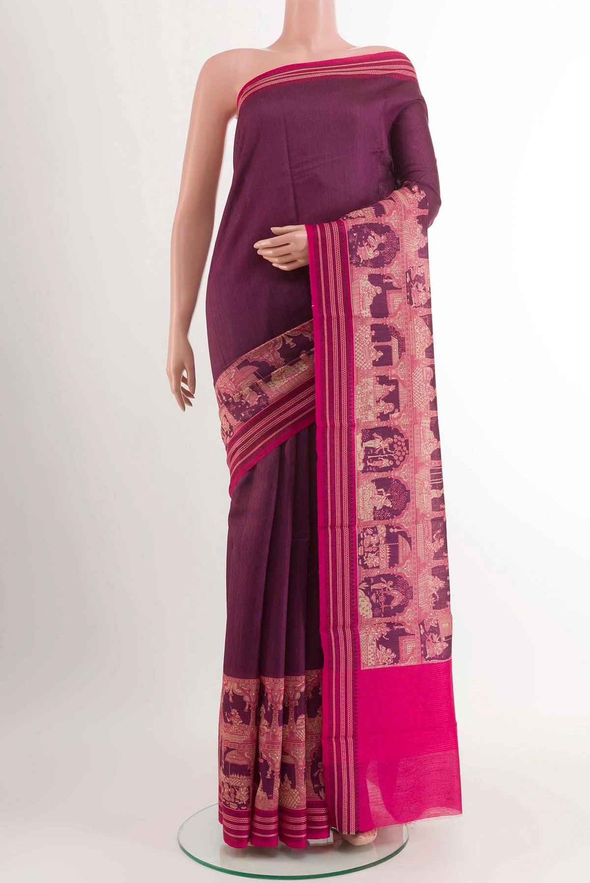 Magenta Tussar Saree With Printed design on the body and Printed Border displayed on a mannequin