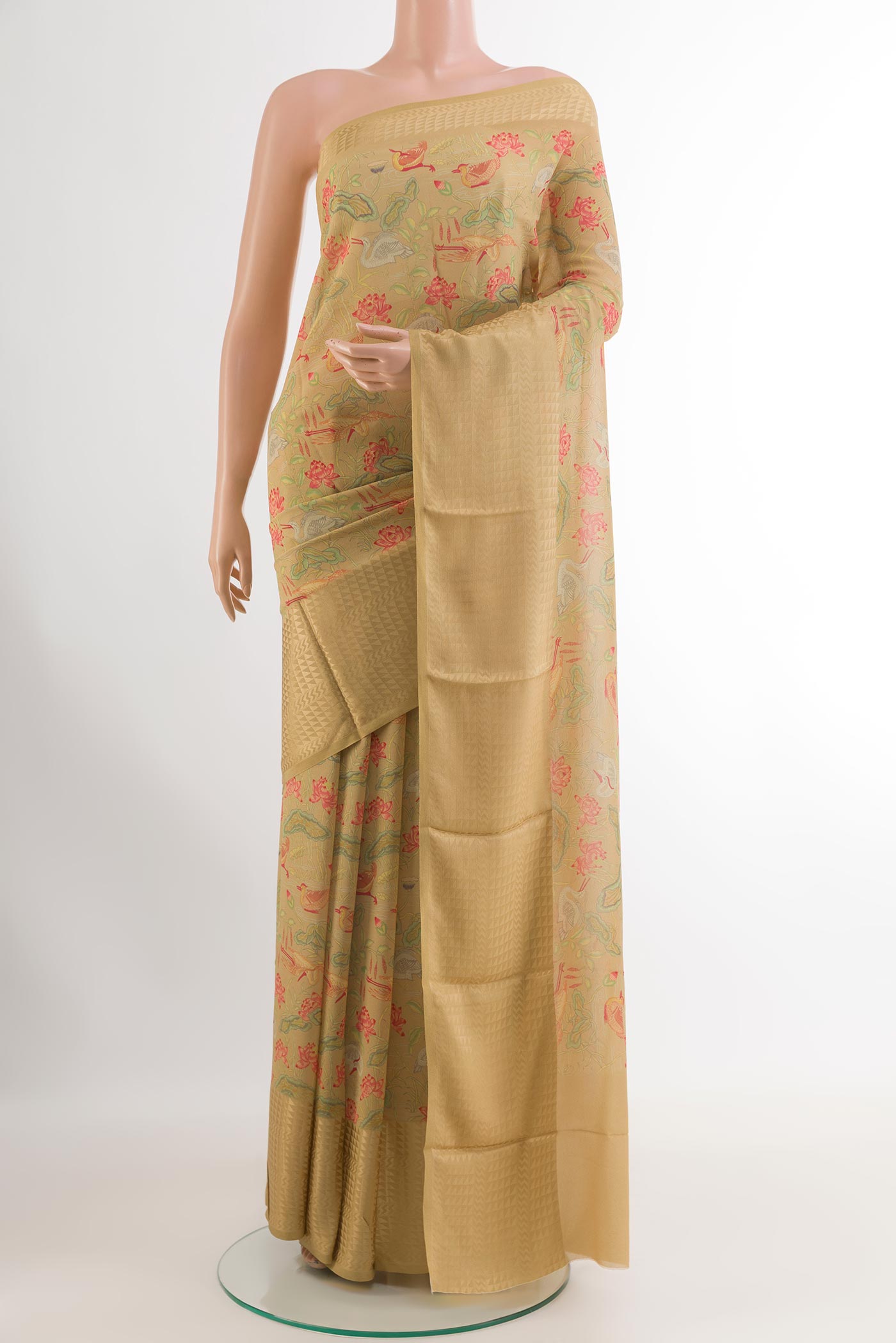 Beige Crepe Saree with Printed design on the body and Printed Border.  displayed on a mannequin