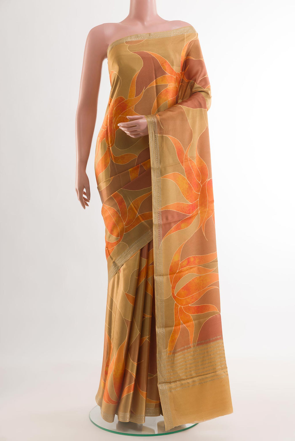 Mustard Satin Silk Saree with Printed design on the body and Zari Border.  displayed on a mannequin