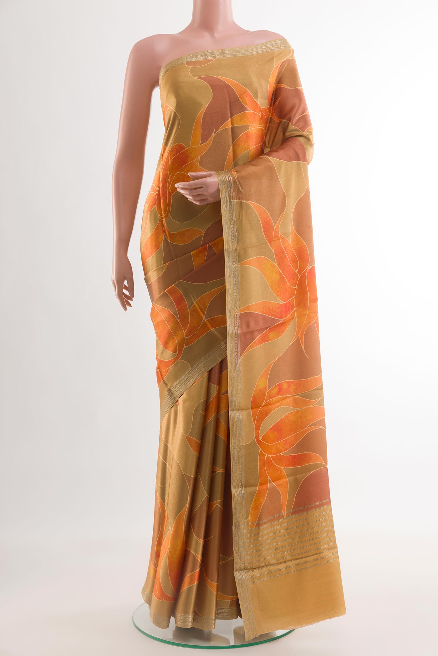 Mustard Satin Silk Saree with Printed design on the body and Zari Border.  displayed on a mannequin