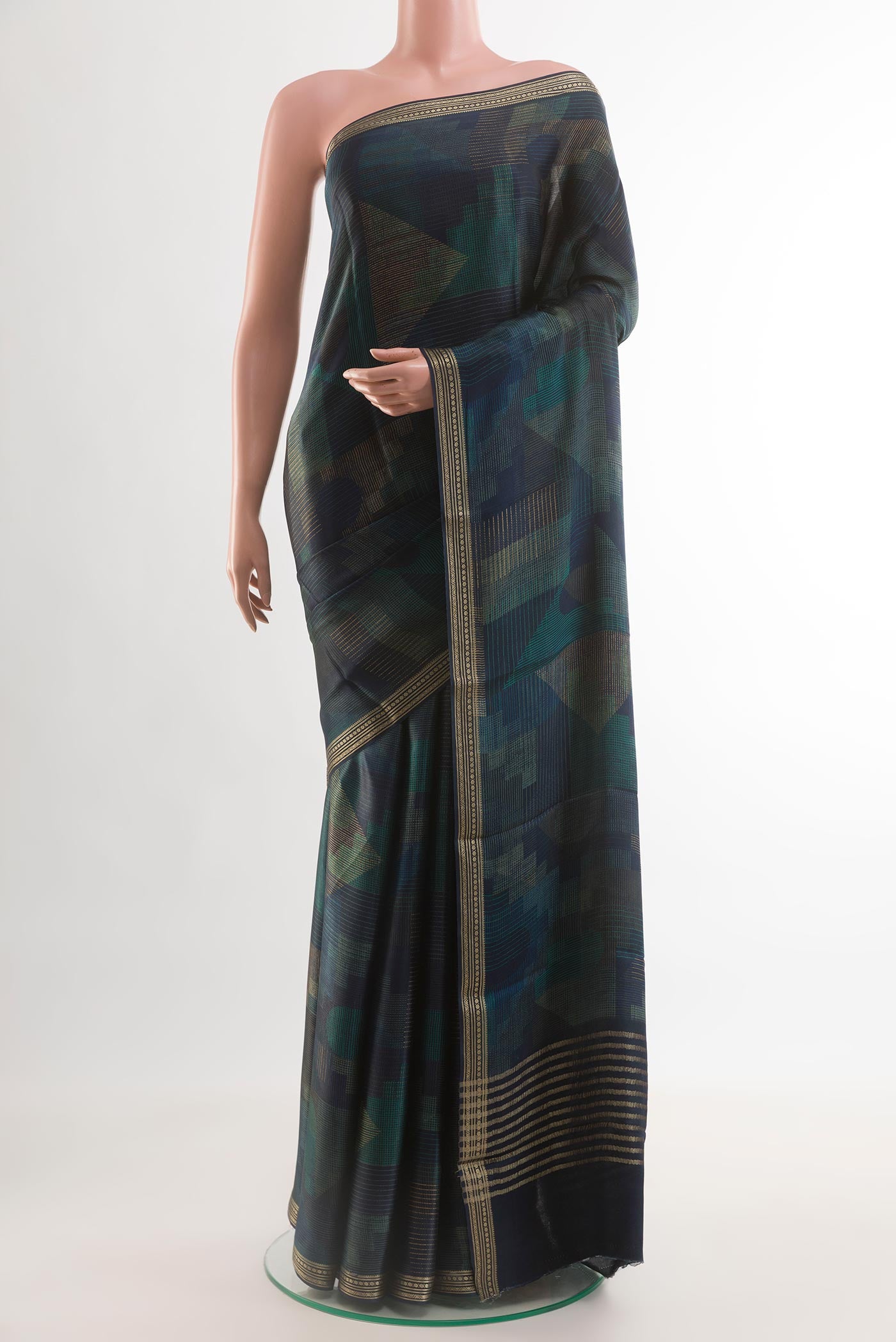 Navy Blue Satin Silk Saree with Printed design on the body and Zari Border.  displayed on a mannequin