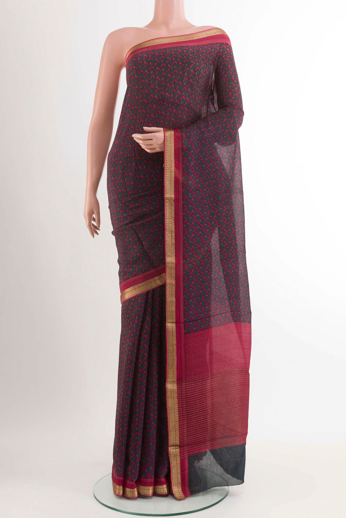 Black Crepe SareePrinted design on the body and Zari Border displayed on a mannequin