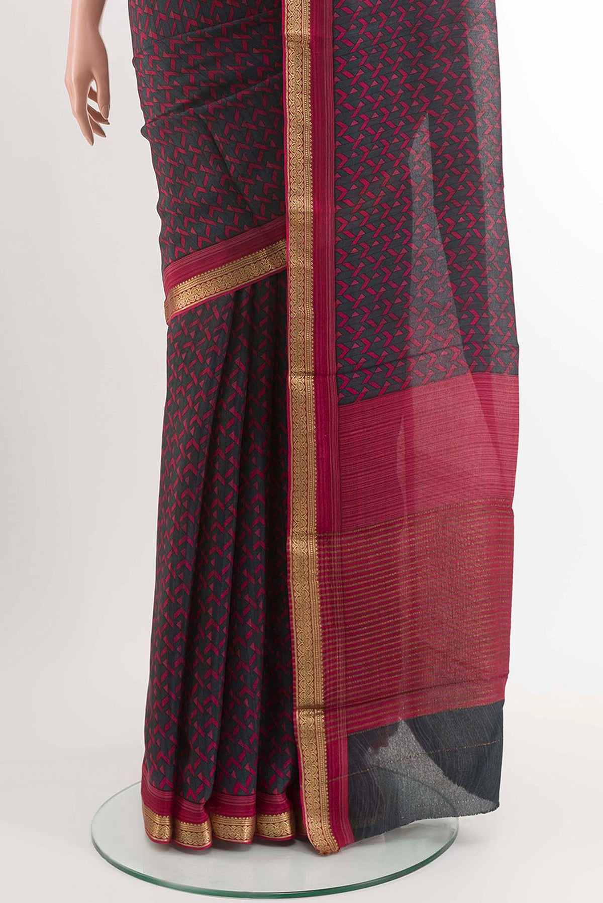 Pleats and pallu of Black Crepe SareePrinted design on the body and Zari Border