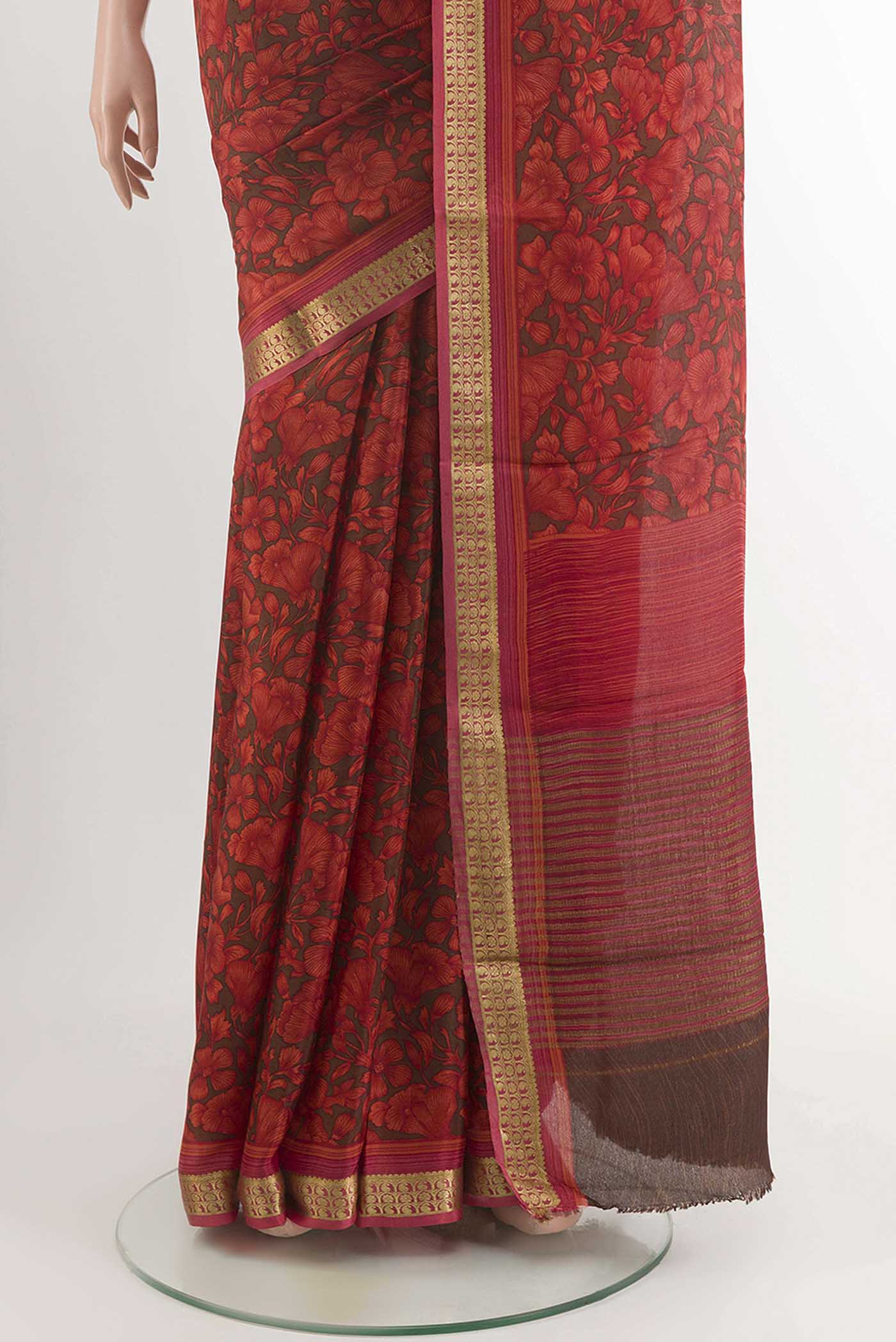 Pleats and pallu of Red Crepe Saree With Printed design on the body and Zari Border