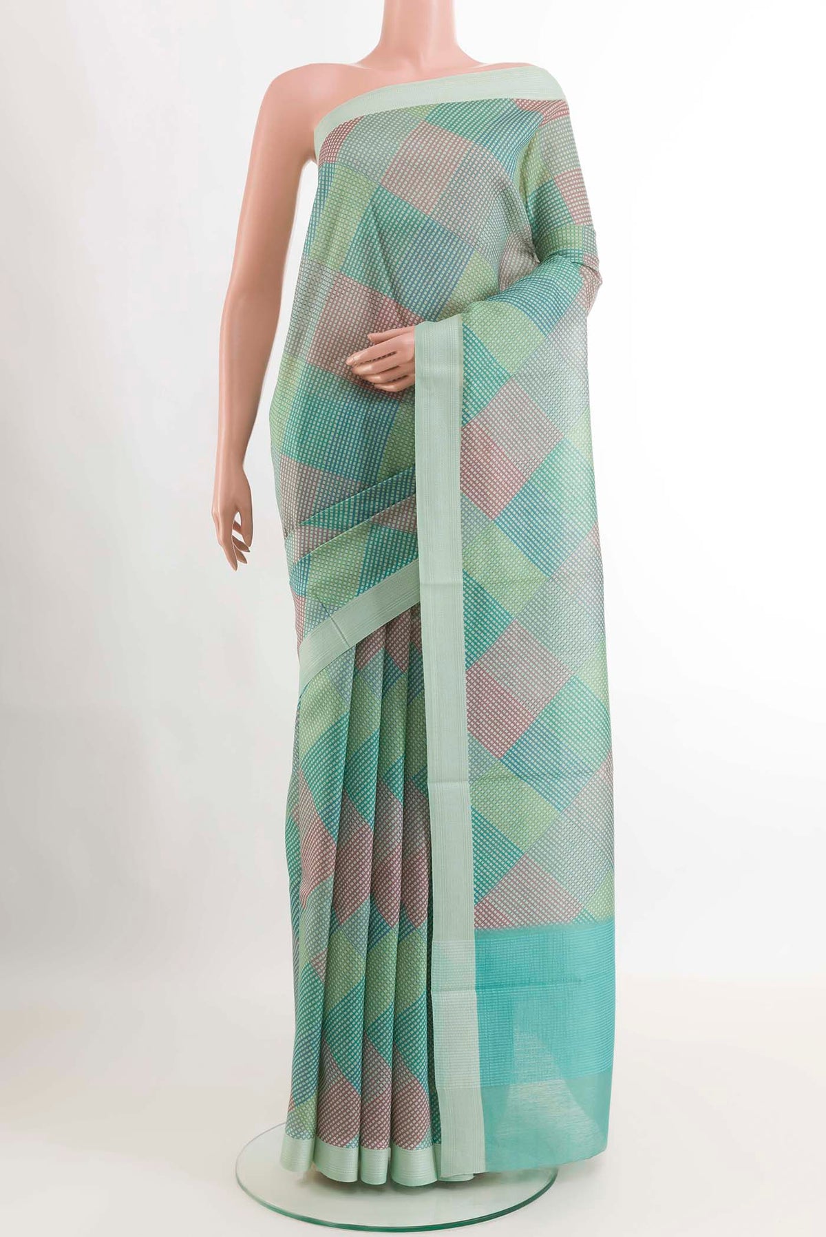 Teal Tussar SareePrinted design on the body and Embroidery Border displayed on a mannequin