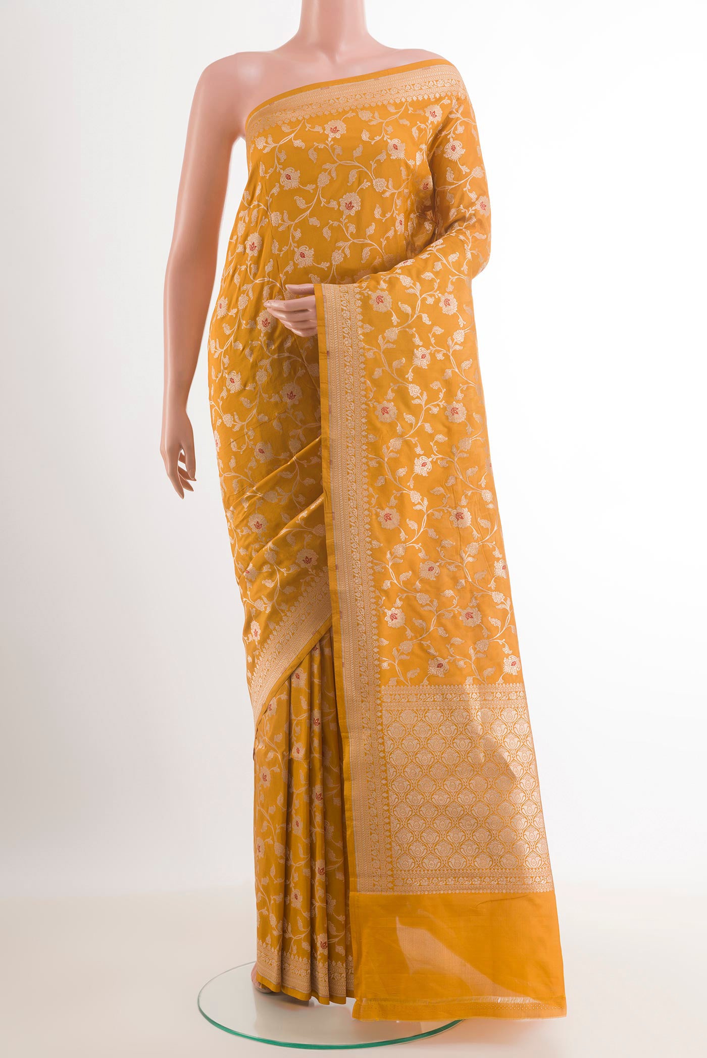 Mustard Banarasi Silk Saree with Zari Brocade on the body and Zari Border.  displayed on a mannequin