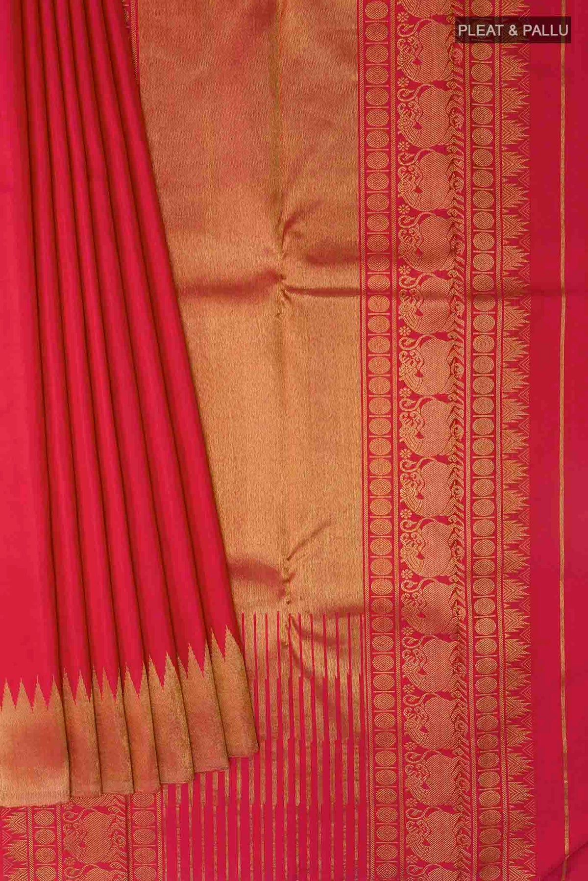 Pleats and pallu of Maroon Kanchipuram Silk Saree with Plain Body and Rising Temple Border