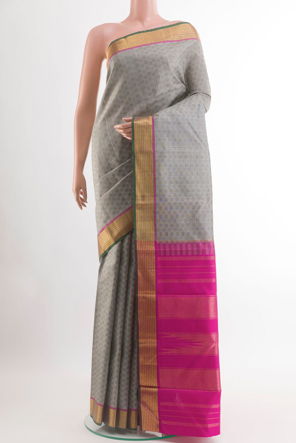 Grey Kanchipuram Silk Saree with Checked design on the body and Zari Border.  displayed on a mannequin